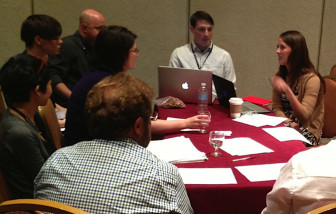 Lauren Fuhrmann of the Wisconsin Center for Investigative Journalism leads a breakout group on "Evaluation in a Box."